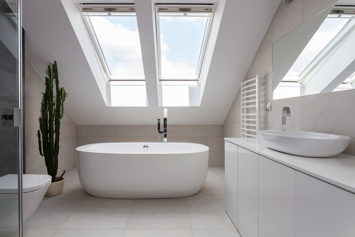 Porcelain freestanding bath in designed white bathroom